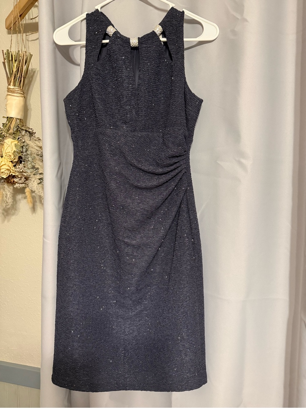Elegant Black Shimmer Sleeveless Sheath Dress with Embellished Neckline